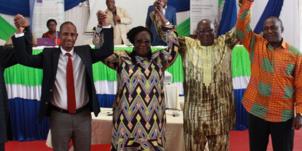 The Leaders of the four political parties in the Parliament of Sierra Leone and the President of the Female Caucus in solidarity salute at the just concluded Parliamentary Leadership Retreat held in Bo City, Sierra Leone.